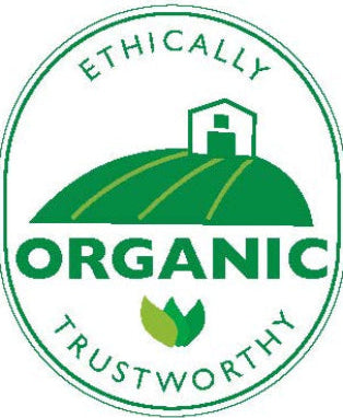 Logo with text 'Ethically Organic Trustworthy' and a green barn illustration on a white background for The Naked Botanical.