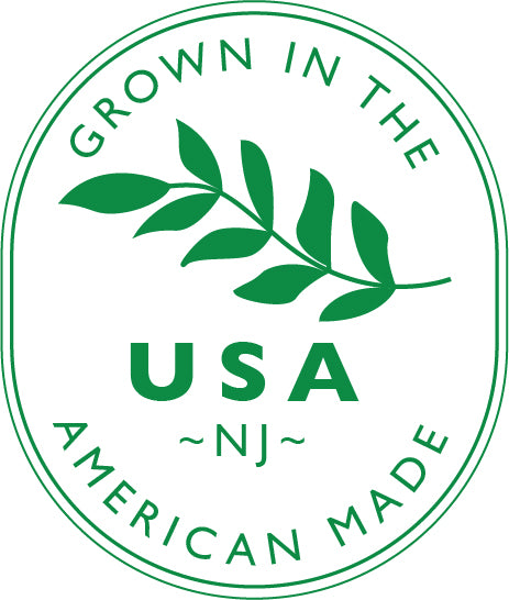 Green logo with 'Grown in the USA, American Made' text and leaf design on a white background for The Naked Botanical